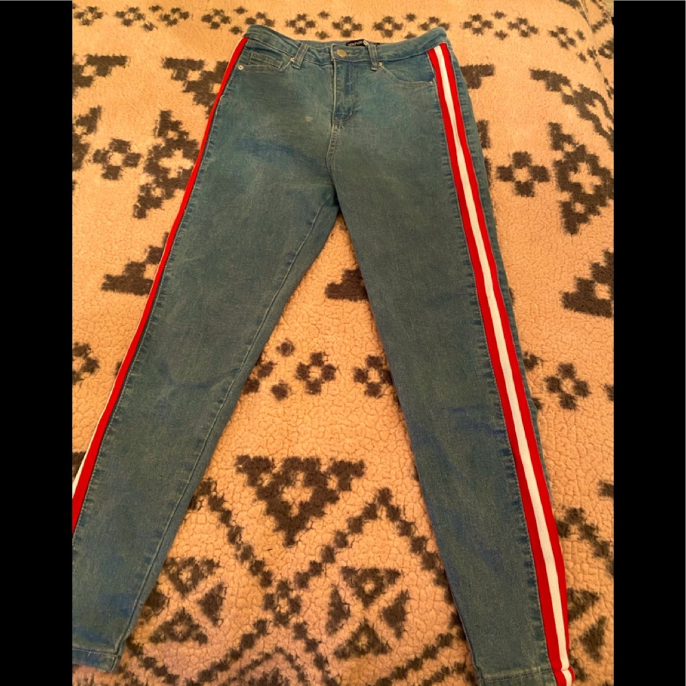Blue jeans with red and white stripe
